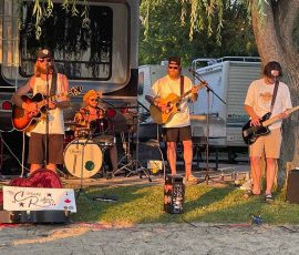 The Canyon Riders Band playing on beach